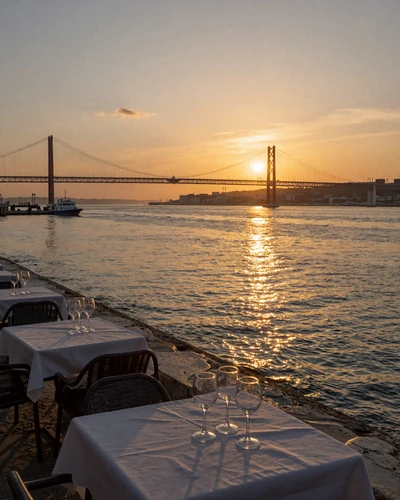 Romantic sunset over the Tagus River in Lisbon with 25 de Abril bridge