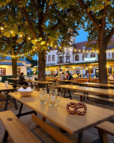 Traditional Bavarian Biergarten in Munich with warm evening lighting