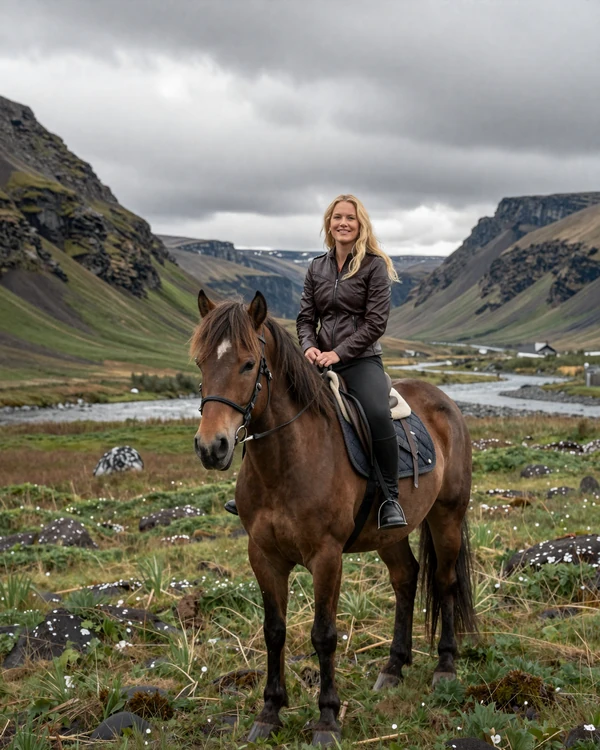 Icelandic woman horseback riding through a scenic Icelandic valley with mountains