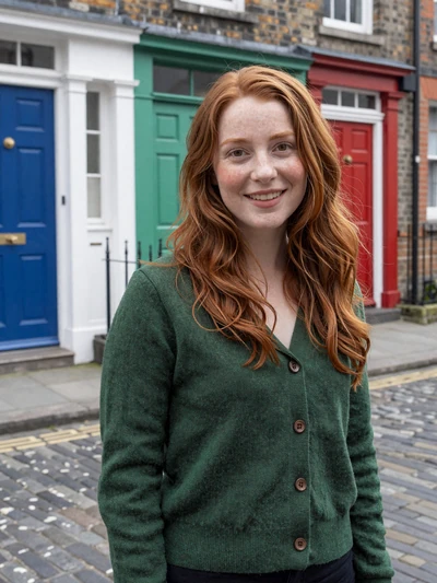 Aoife, 27, Irish woman with auburn hair on a Dublin cobblestone street seeking a partner